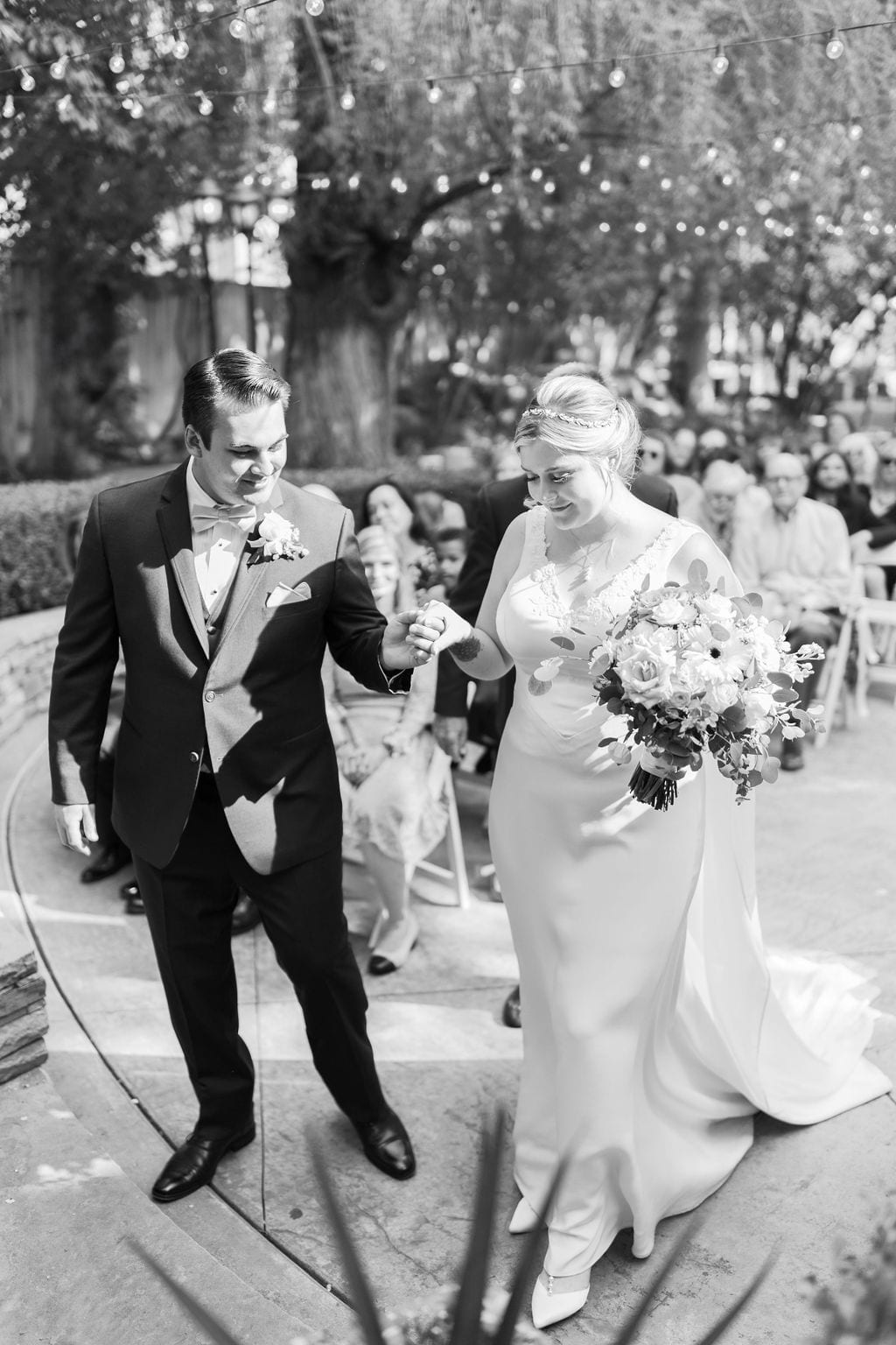 Grace and Miles wedding at Eldredge Manor, just married, the recessional, black and white
