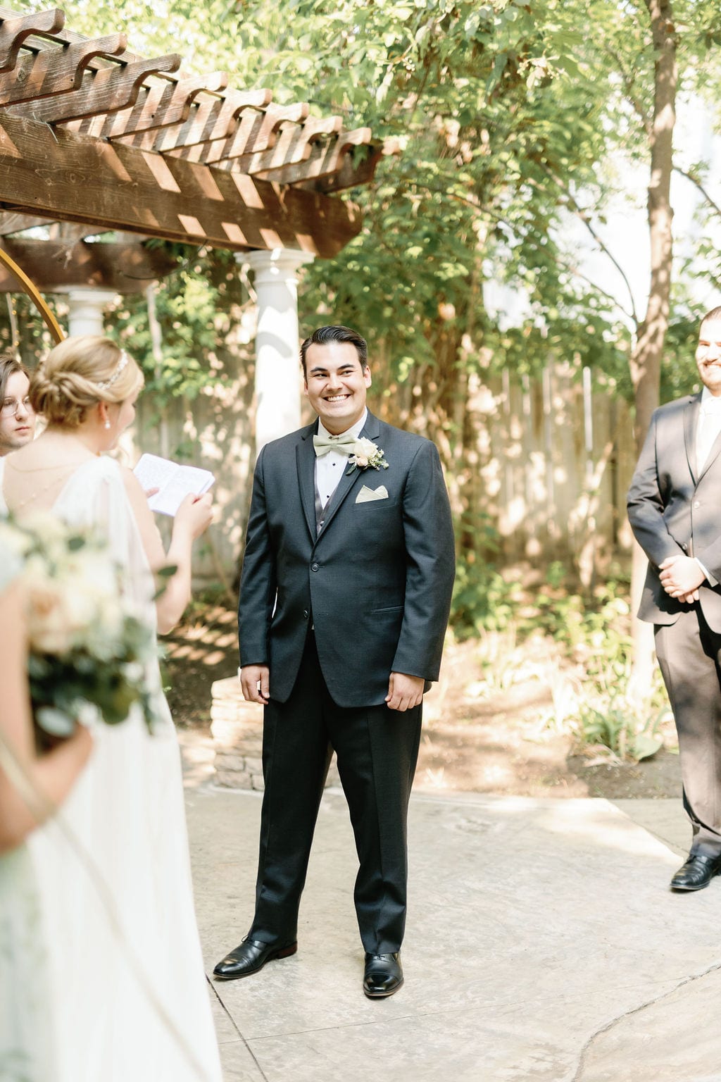 Grace and Miles wedding at Eldredge Manor, the vows beneath the pergola