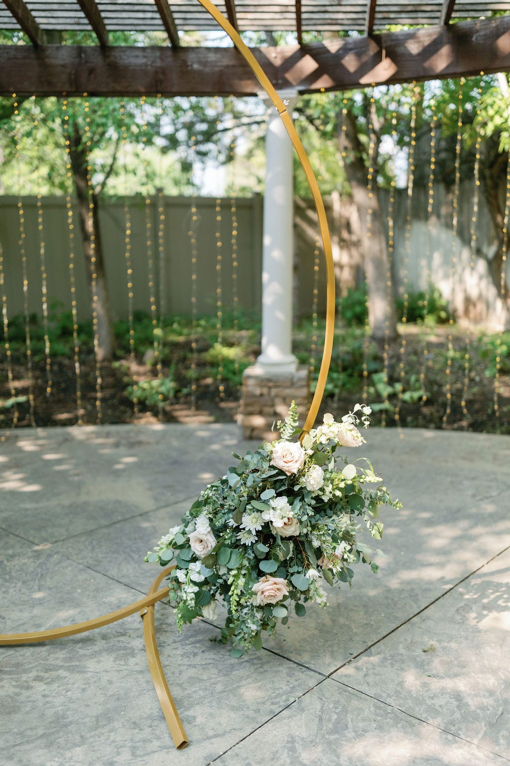 Grace and Miles wedding at Eldredge Manor, pergola florals on the garden path