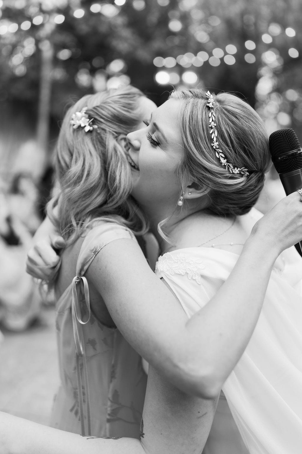 Grace and Miles wedding at Eldredge Manor, an embrace during the toasts, black and white