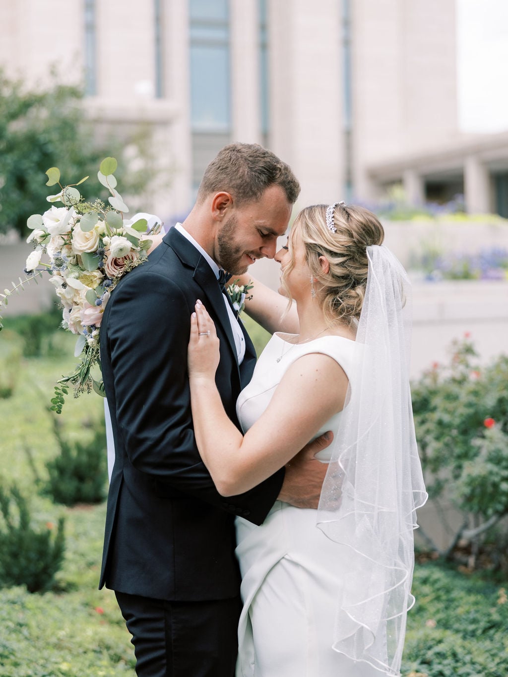 Joe and Holly wedding, a portrait at the temple, forehead to forehead