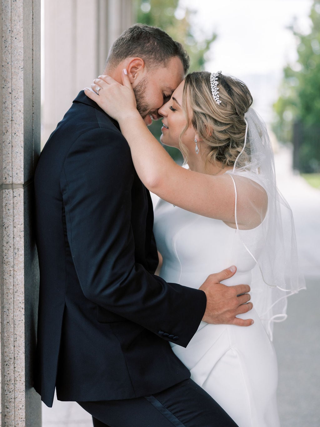 Joe and Holly wedding, an embrace at the temple