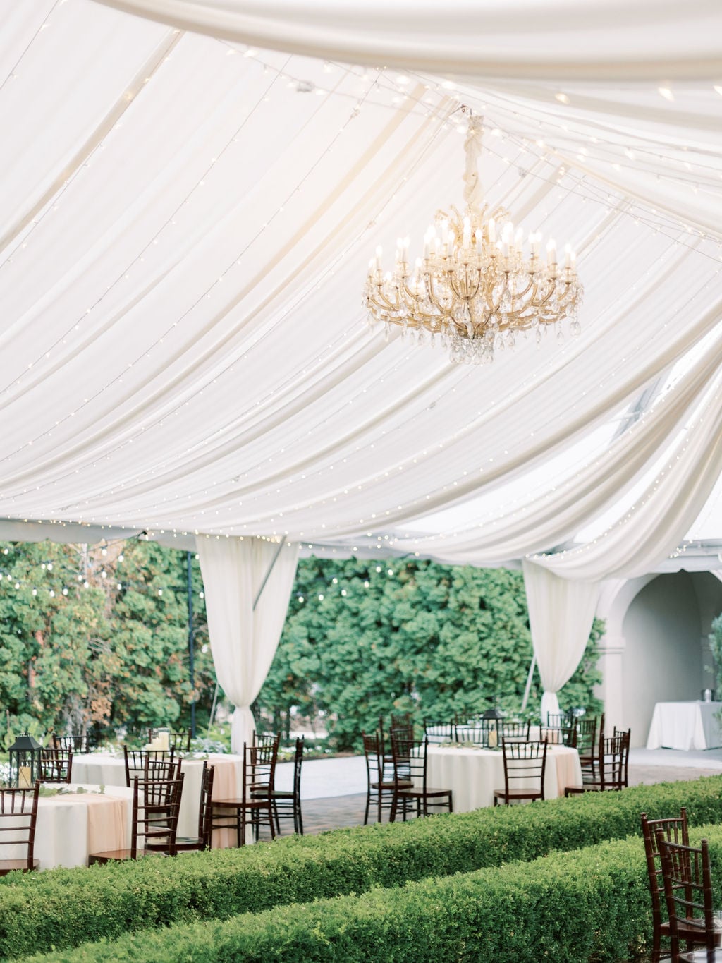 Joe and Holly wedding, the tented reception under chandeliers at Thanksgiving Point