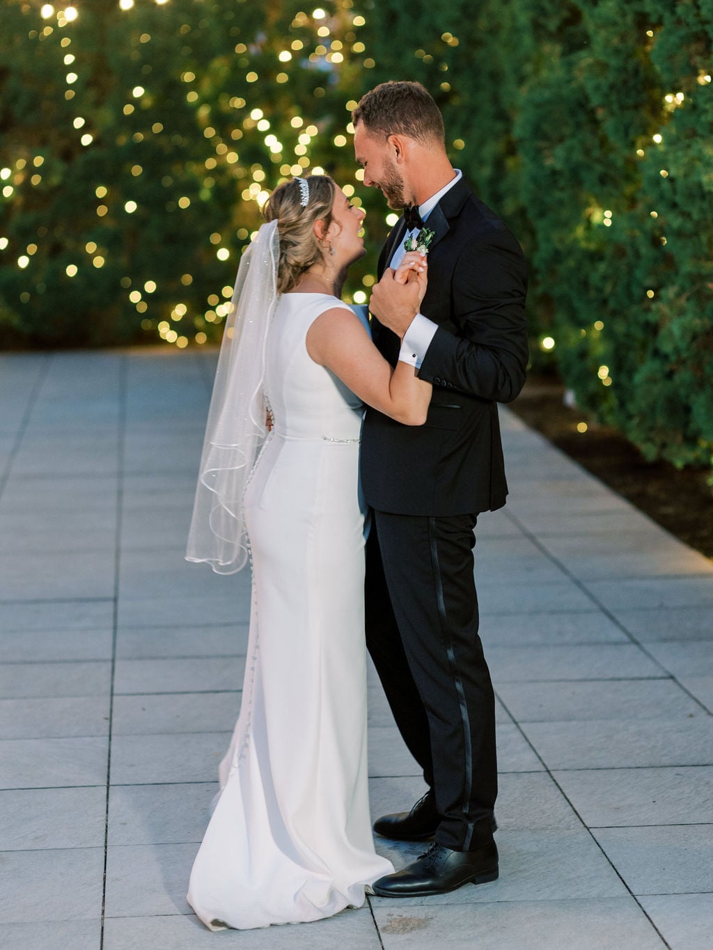 Joe and Holly wedding, the veil and string lights during the first dance