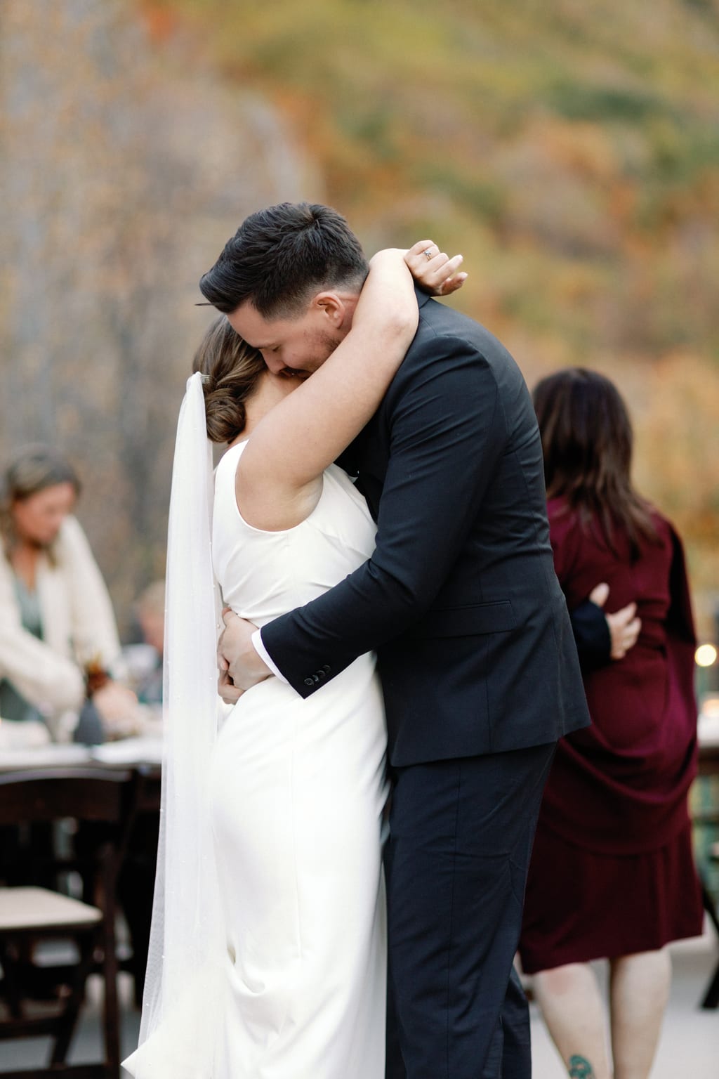 The couple sway close together as the evening ends, a private residence in Sundance, Utah