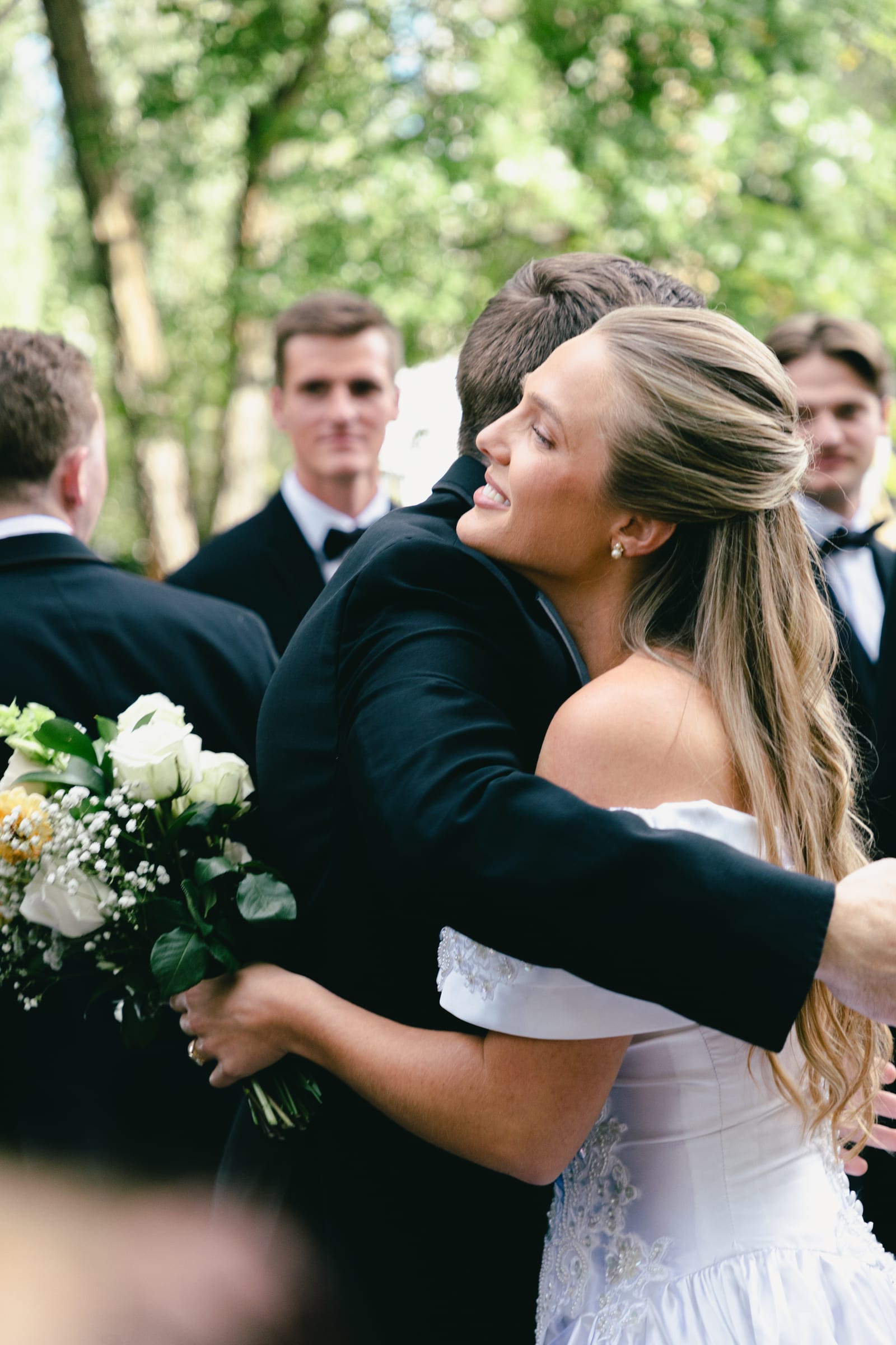 Kyle and Marita wedding at Bellissimo Gardens, an embrace at cocktail hour