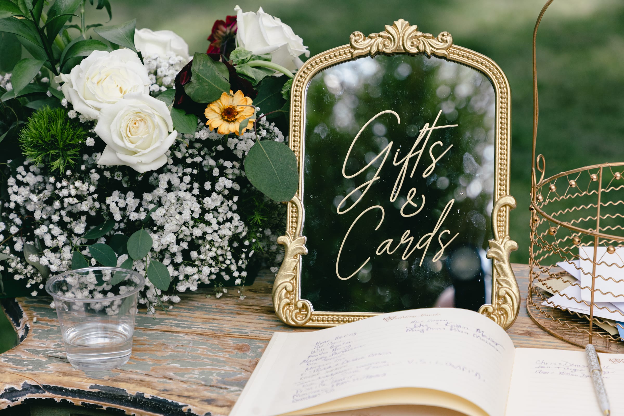 Kyle and Marita wedding at Bellissimo Gardens, reception florals and signage
