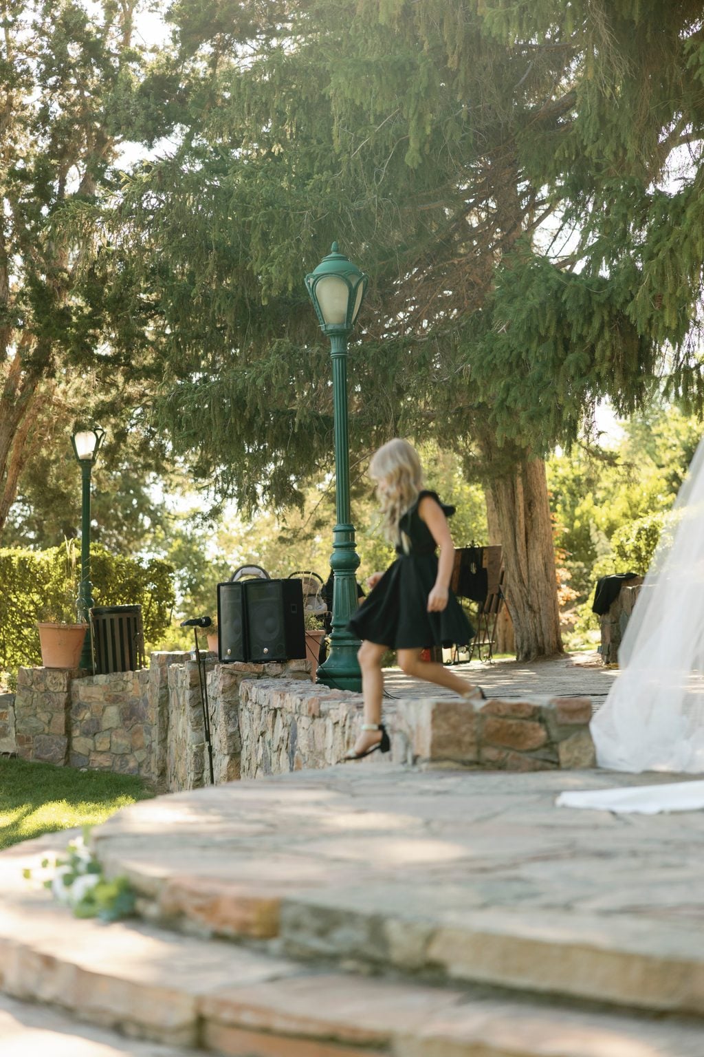 Stone terraces and string lights at the garden ceremony site, a private Utah estate
