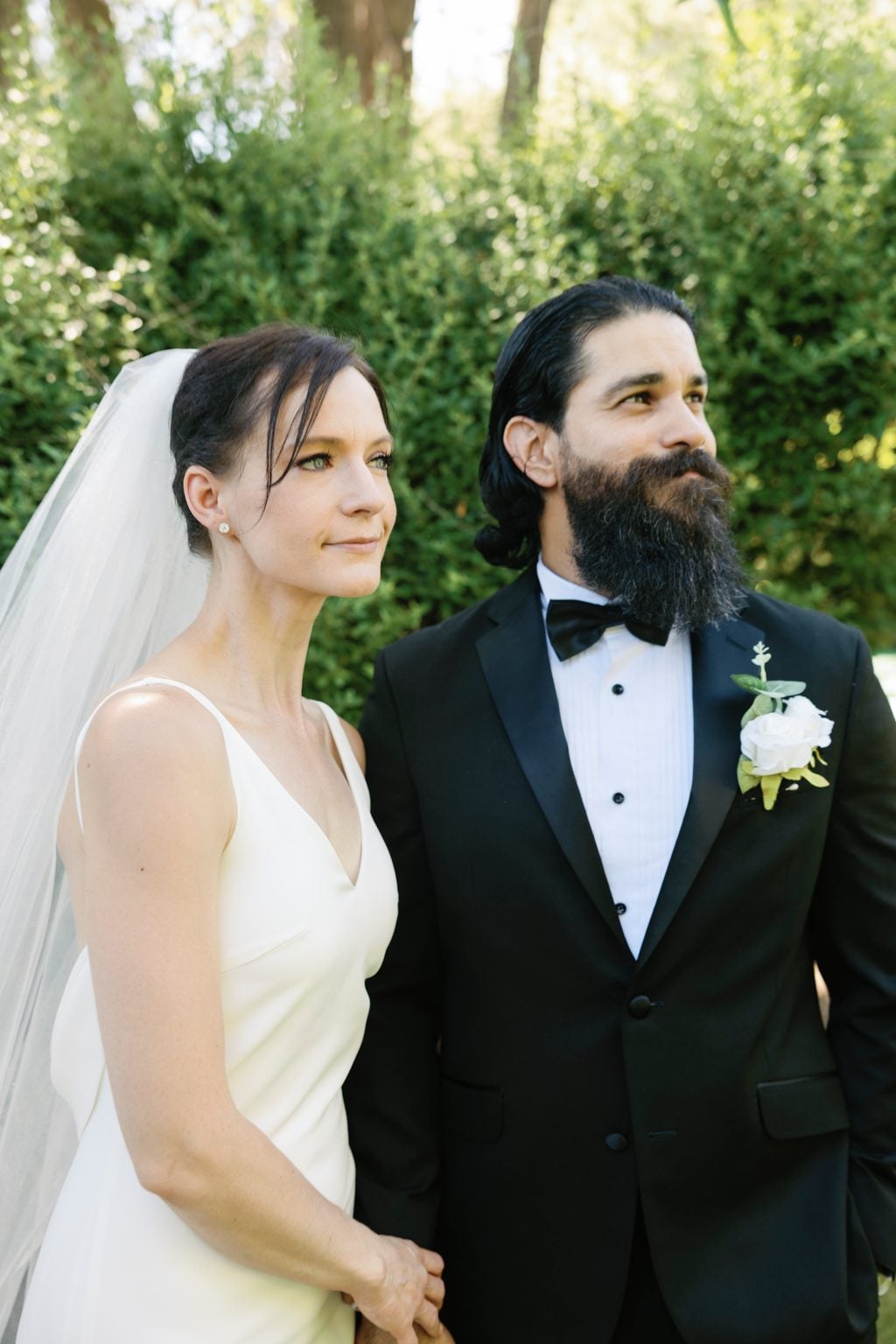 Mallory and Saint face to face during their portraits, a black-tie garden wedding