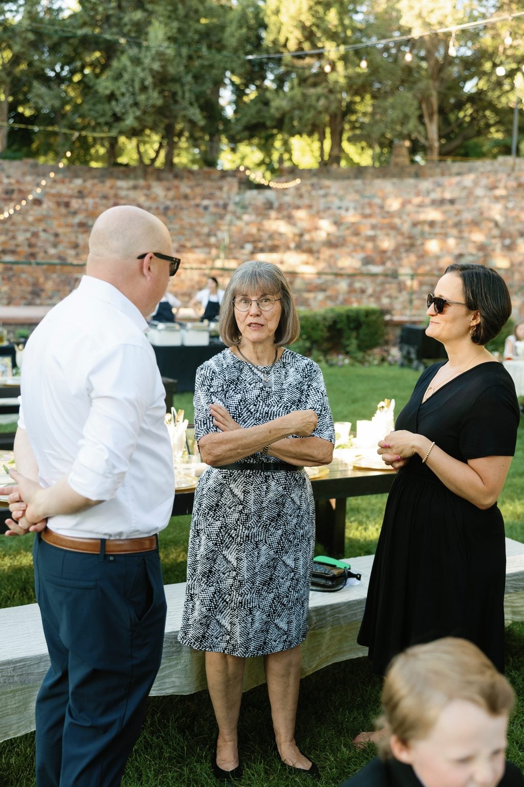 A grazing spread and paella served outdoors at the reception, a Utah garden wedding
