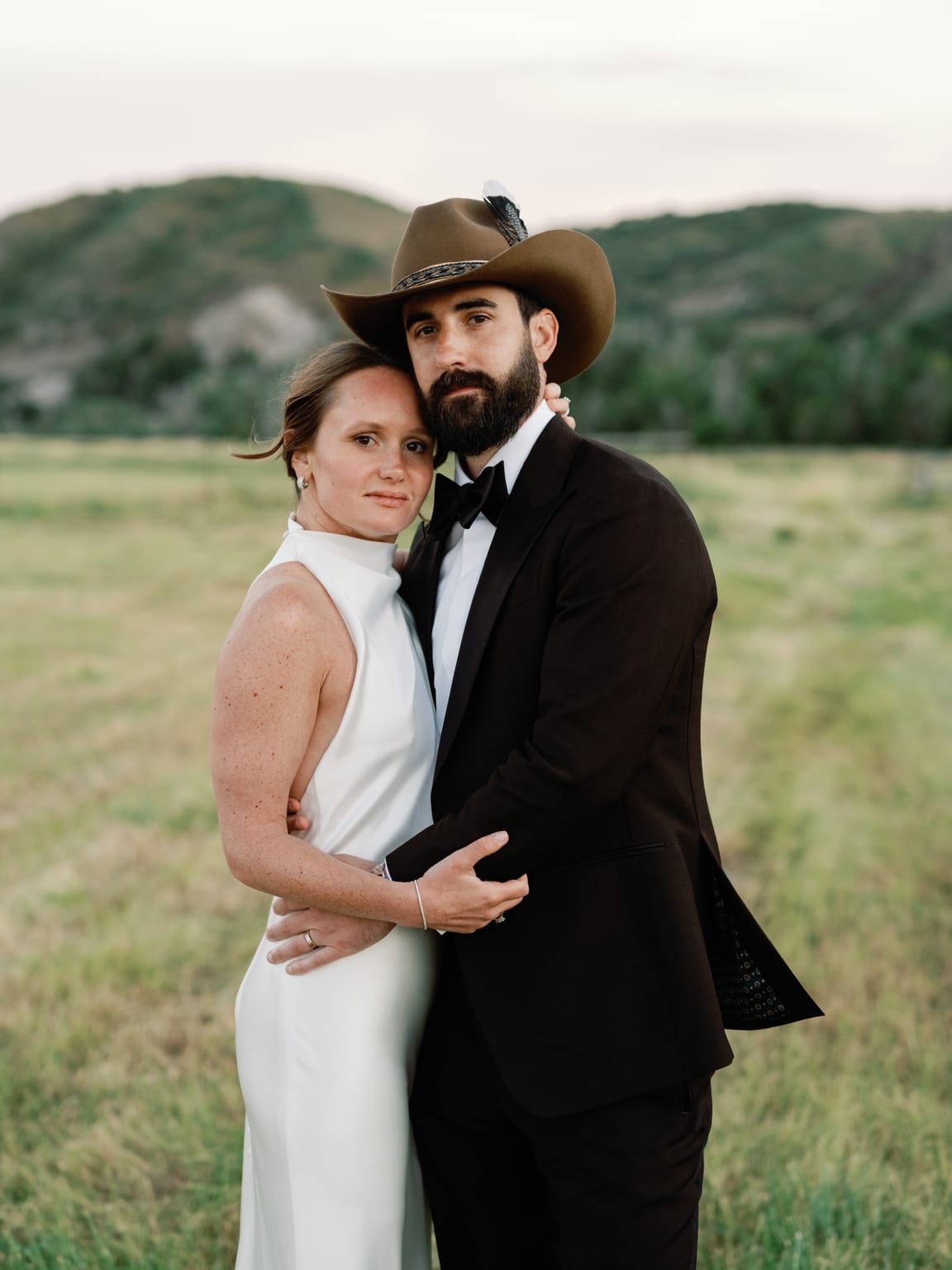 Bride and groom portrait, the groom in a cowboy hat, 4U Ranch wedding in Park City, Utah