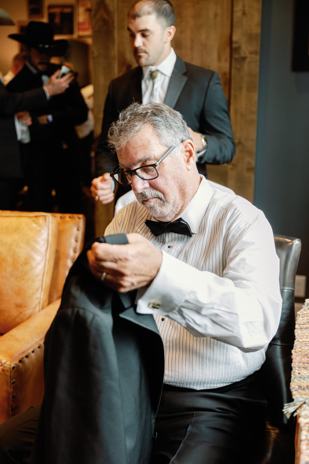 Pinning the groom's boutonniere before the ceremony, 4U Ranch wedding, Park City Utah