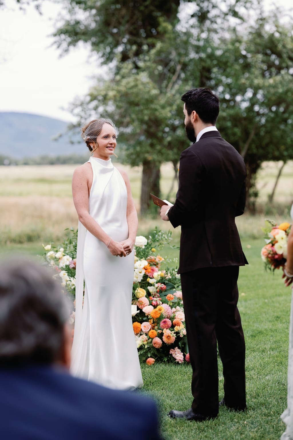 Bride and groom at the altar with the ranch landscape beyond, 4U Ranch wedding, Park City Utah