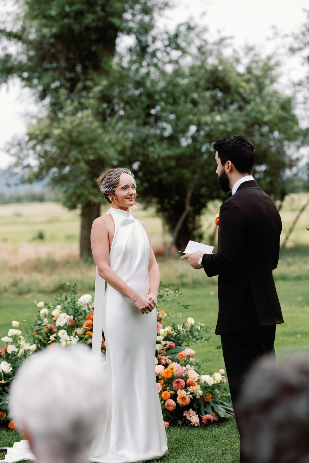 The bride radiant during the vows at an outdoor 4U Ranch wedding in Park City, Utah