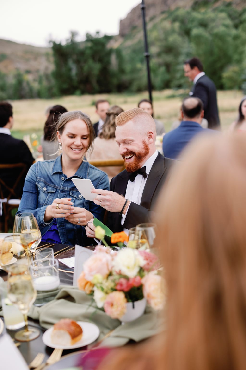 A toast at the head table under warm string lights, a 4U Ranch wedding in Park City, Utah