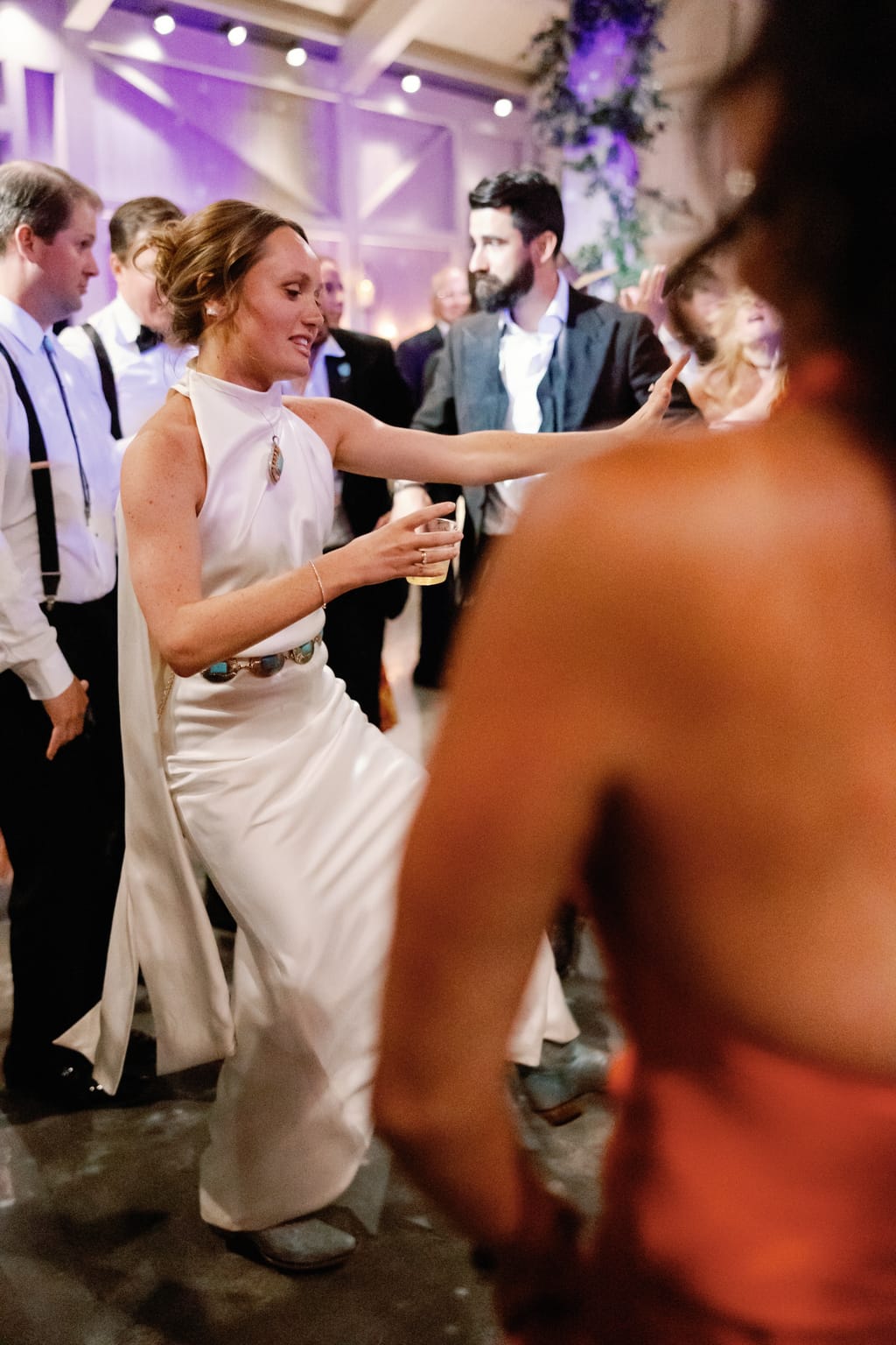 Bride and groom dancing among guests at the reception, 4U Ranch wedding in Park City, Utah