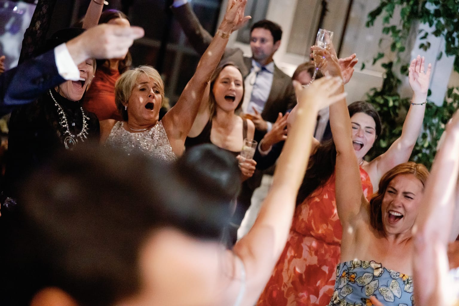 Guests fill the dance floor under string lights at a 4U Ranch wedding in Park City, Utah