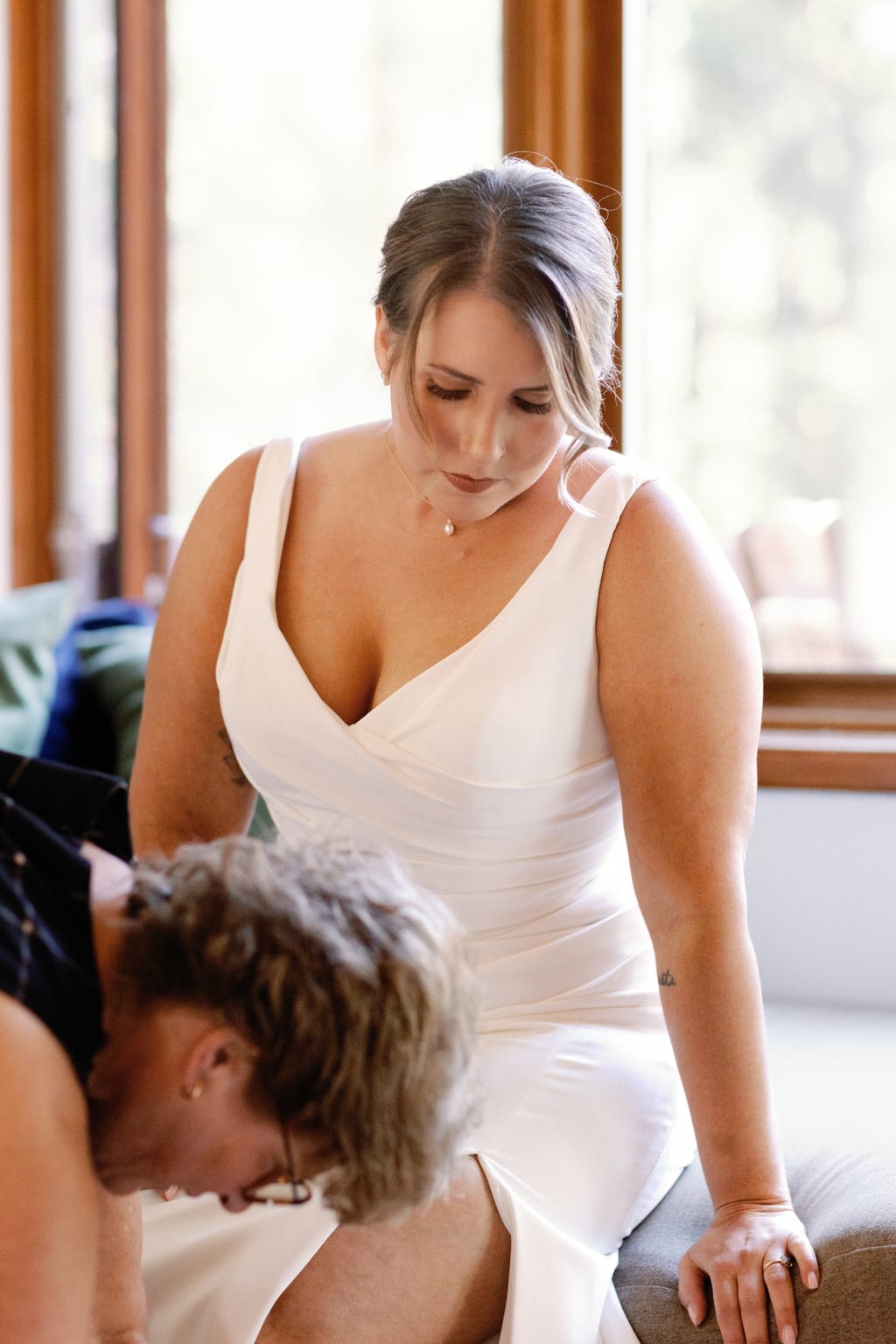 The bride stepping into her wedding gown, private residence in Sundance, Utah