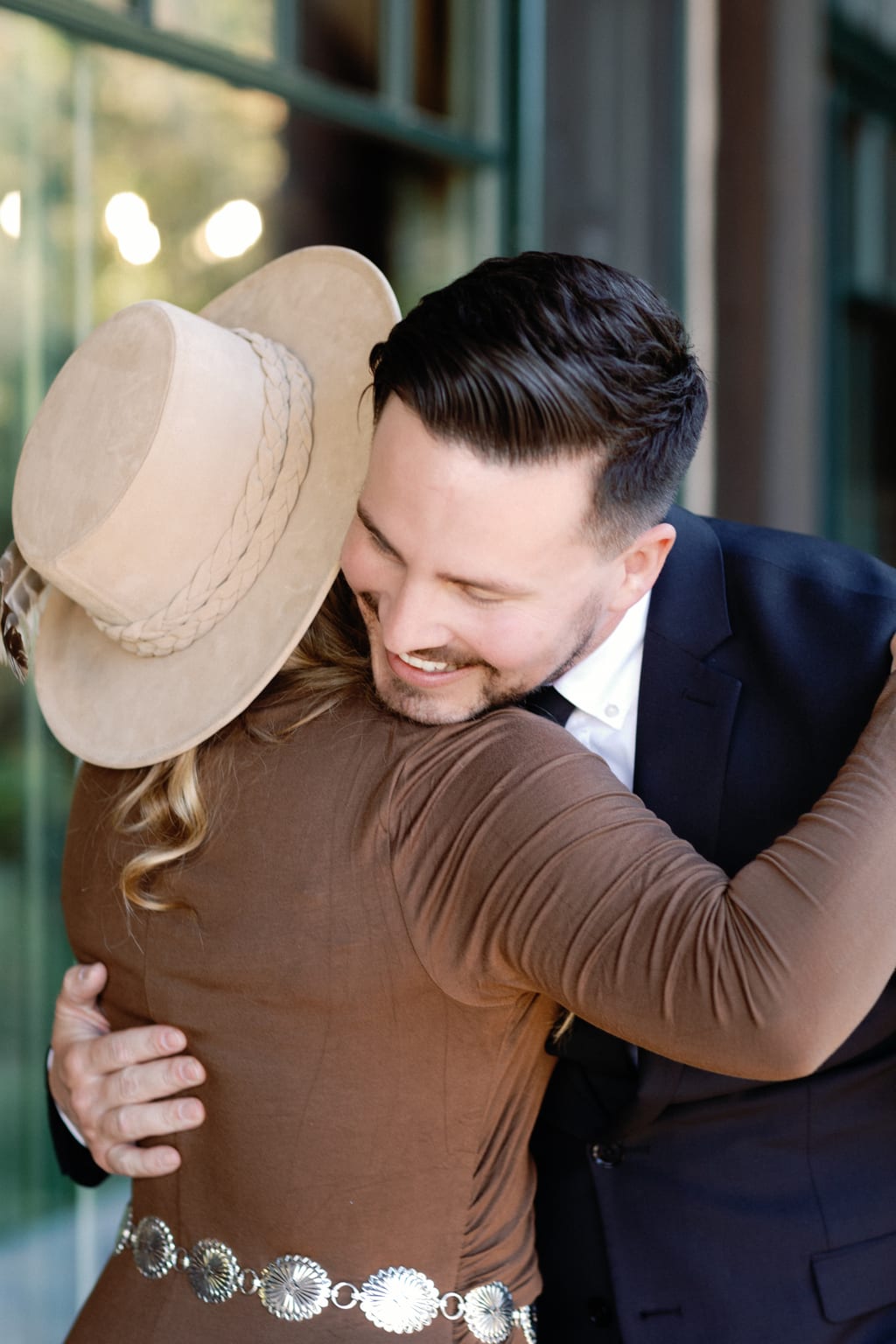 The groom embracing his father before the ceremony, Sundance, Utah