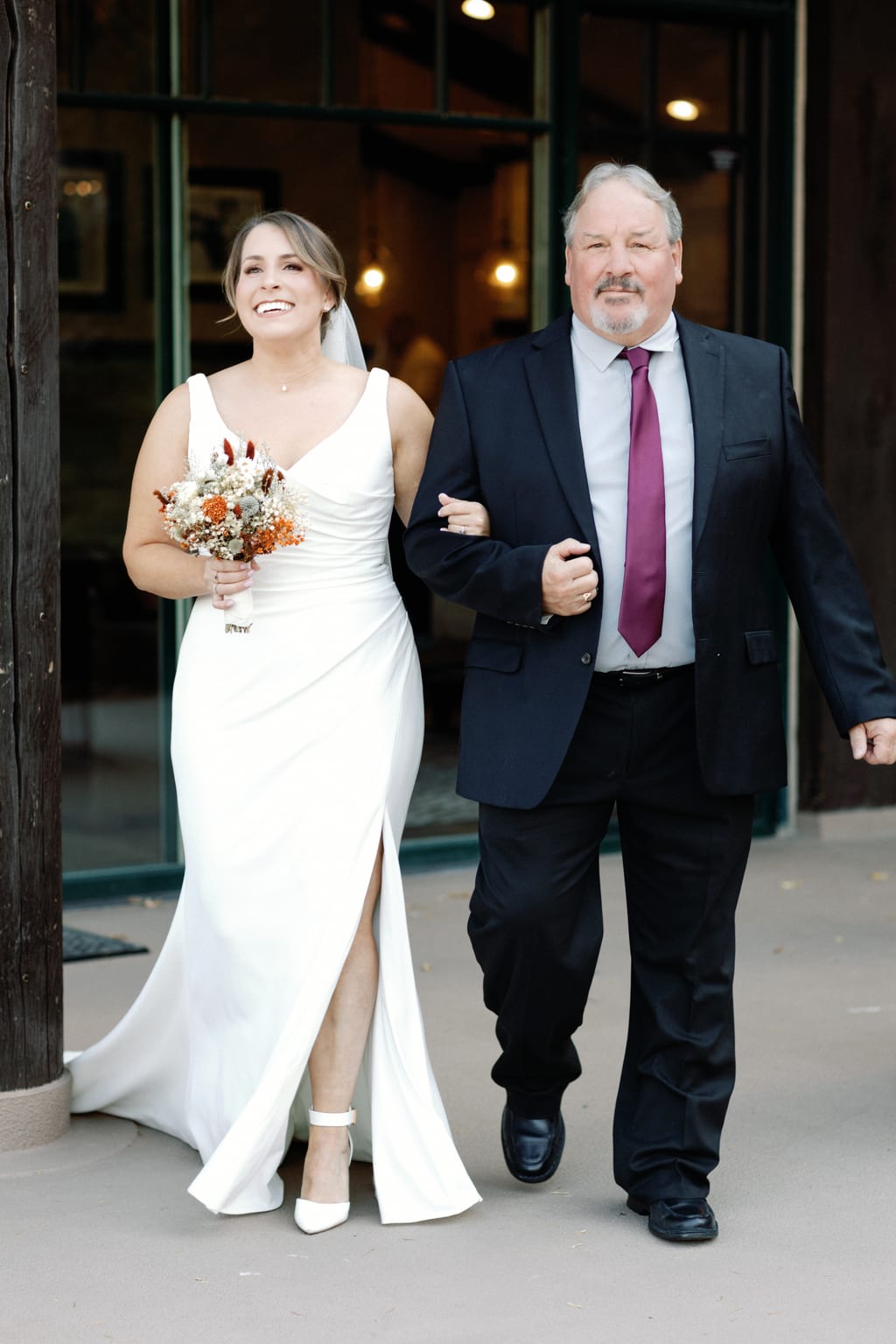 The bride walking down the aisle with her father, mountain ceremony in Sundance, Utah
