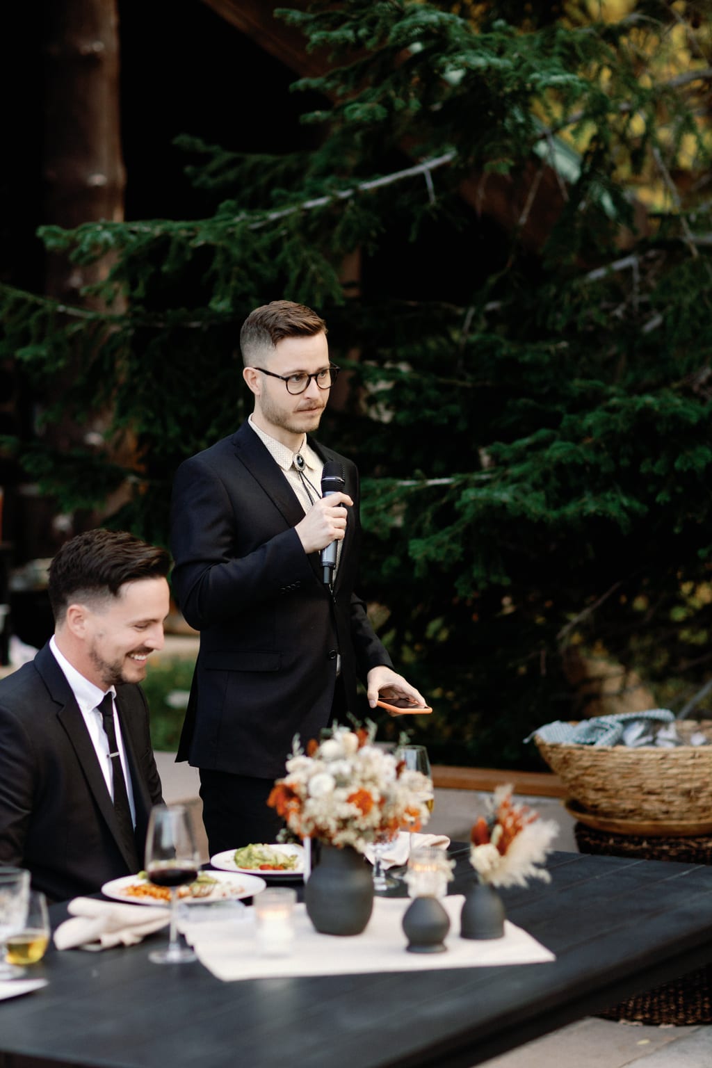 The groom raising a toast in the evening light, private Sundance residence